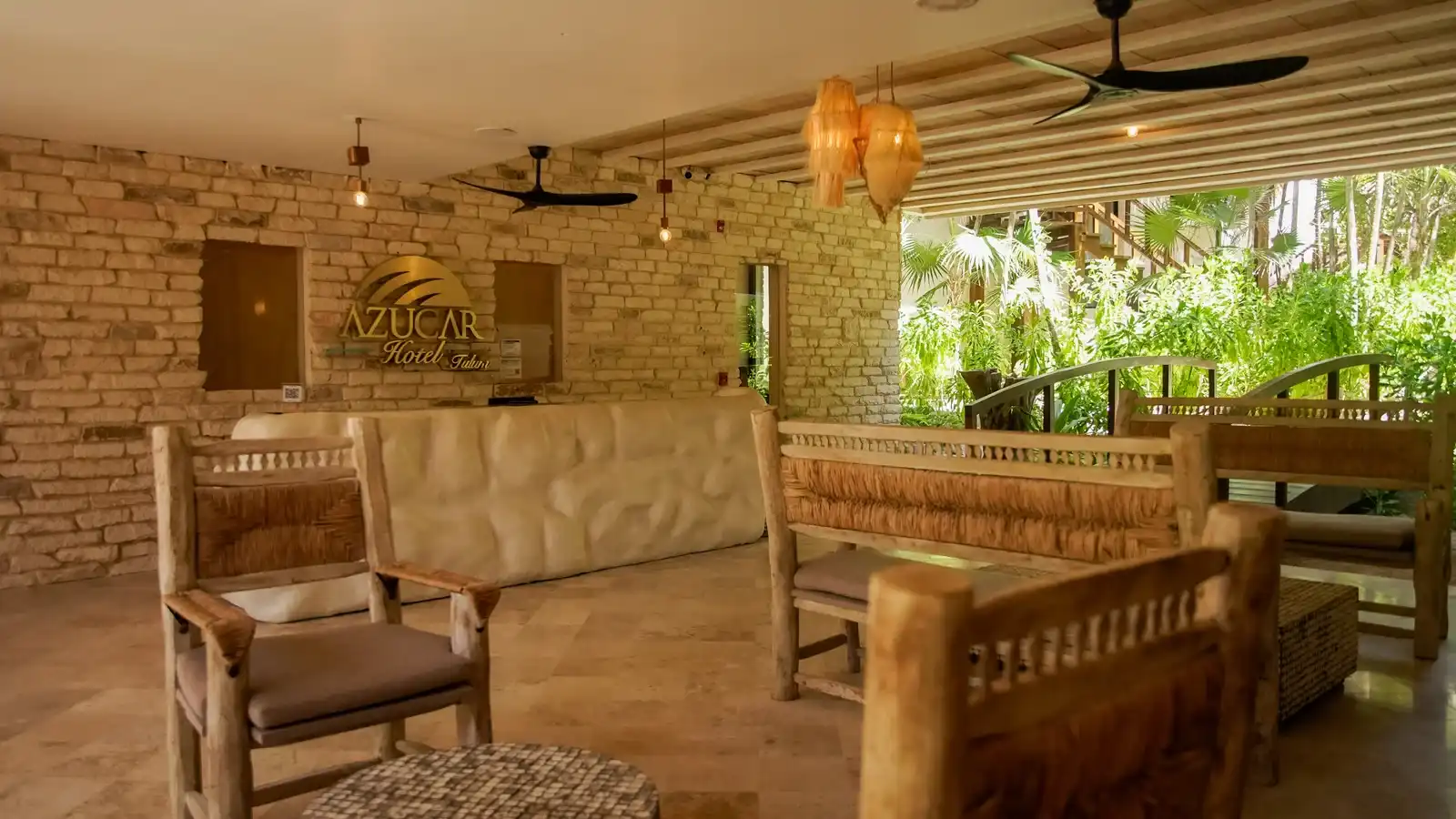 The hotel reception: the wooden counter with the logo behind it, and the seating benches.